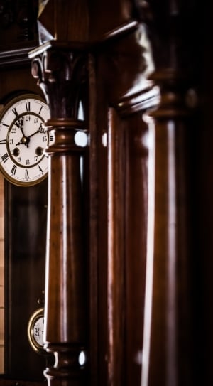 brown wooden grandfathers clock second person view photography thumbnail