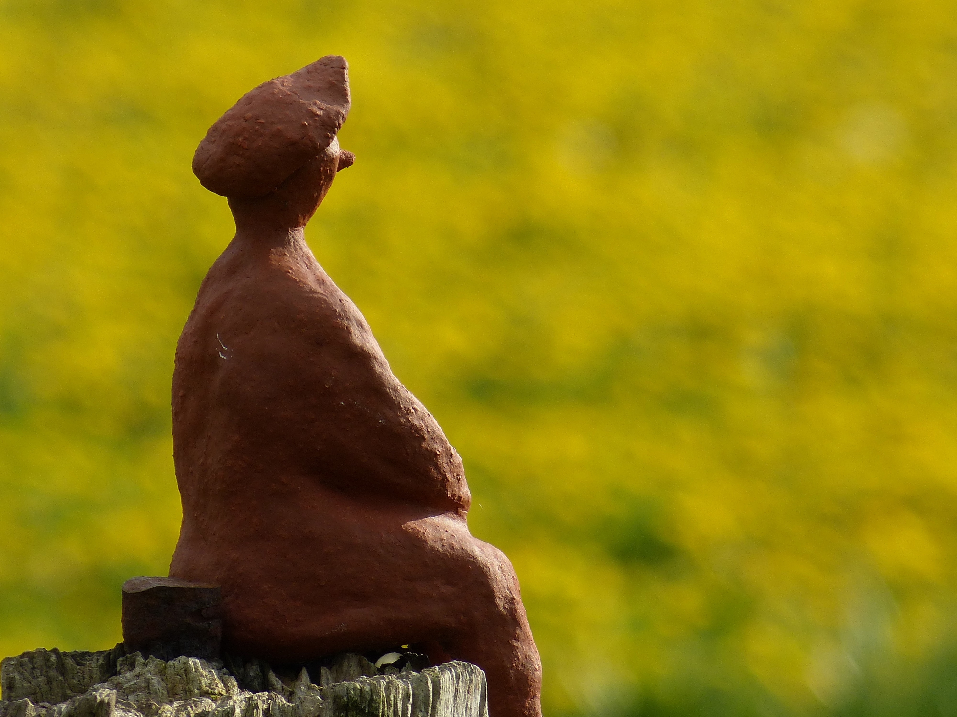 ceramic figurine of man sitting