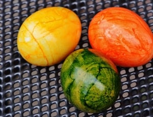 three yellow, orange and green eggs thumbnail