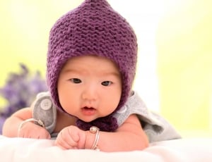 baby's brown knitted cap thumbnail