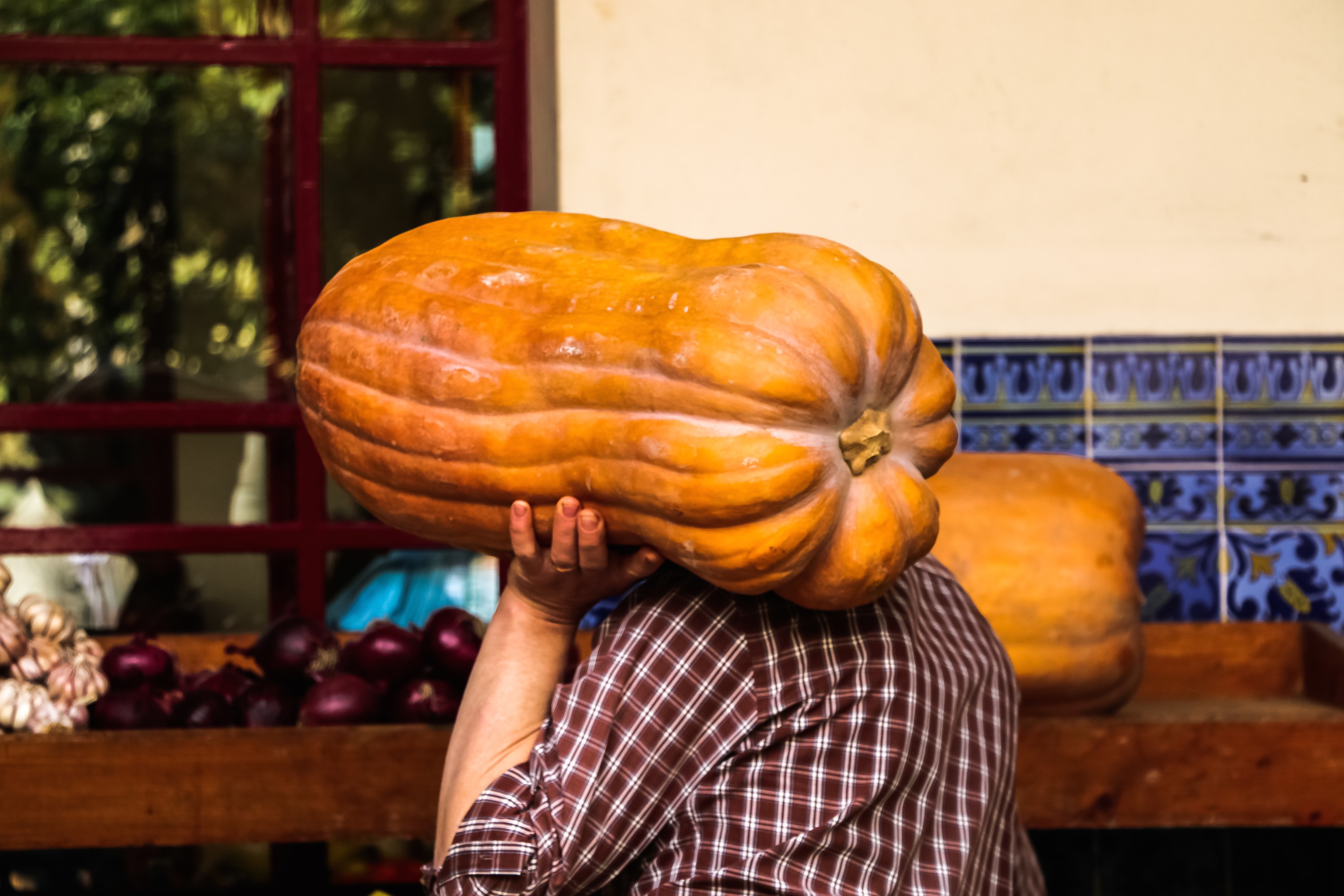 man crarrying a pumpkin