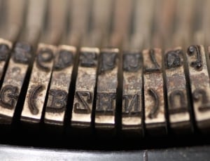 silver and brown steel typewriter part thumbnail