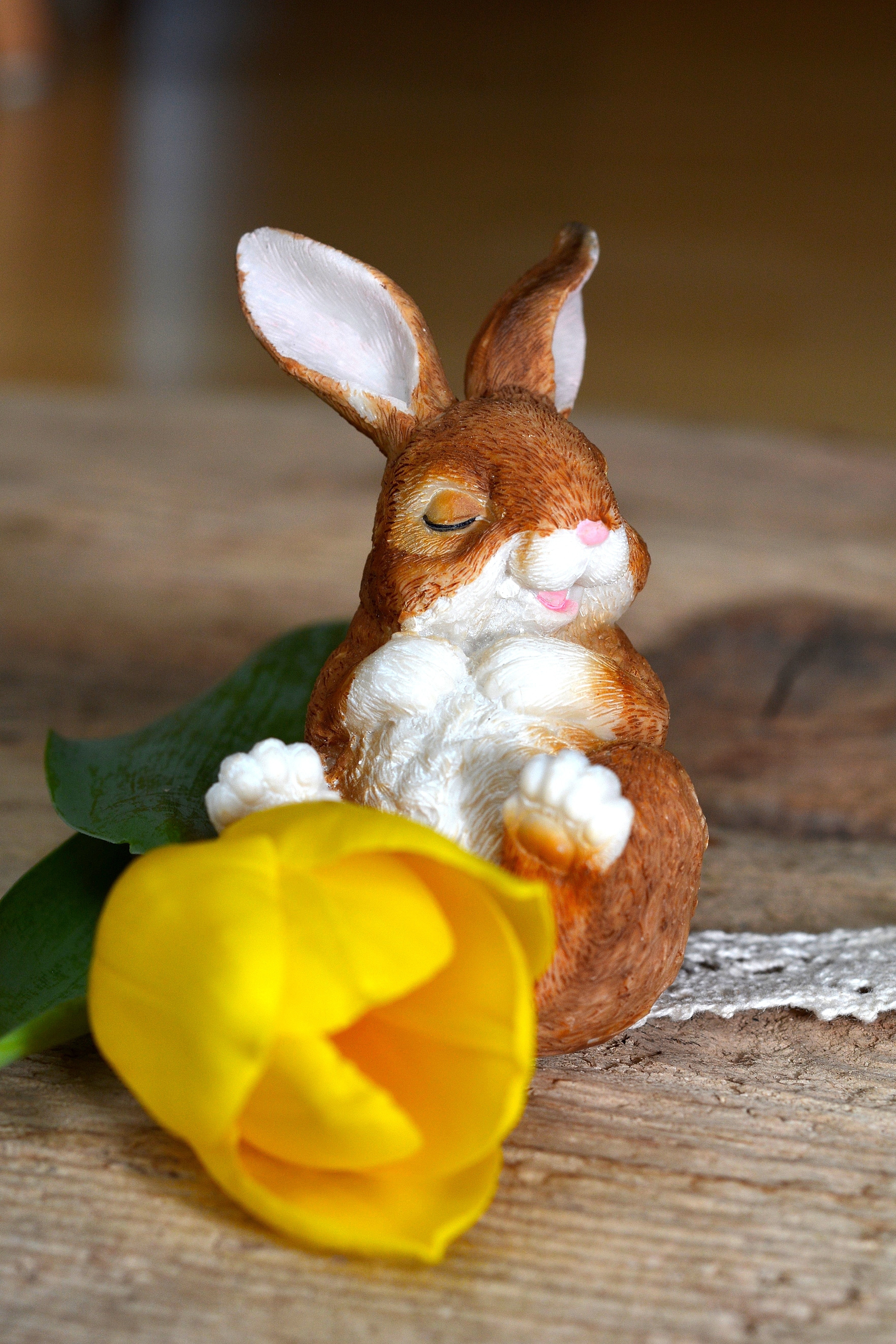 brown and white ceramic rabbit figurine