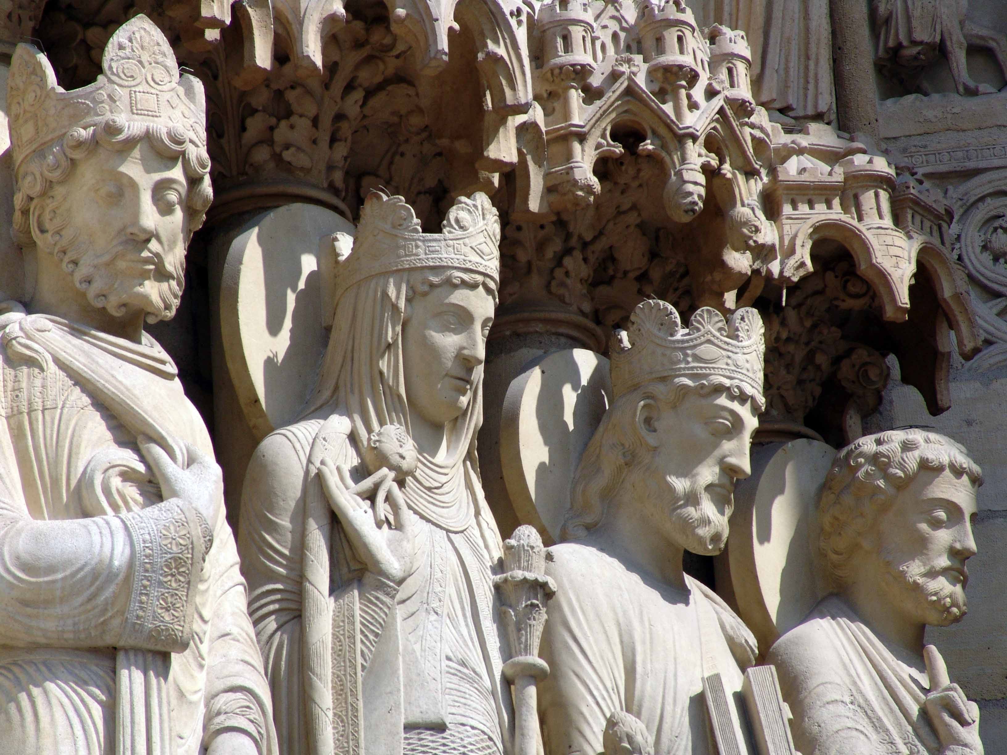 photo of four gray king statues
