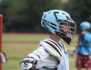 boy's blue and black sports helmet thumbnail