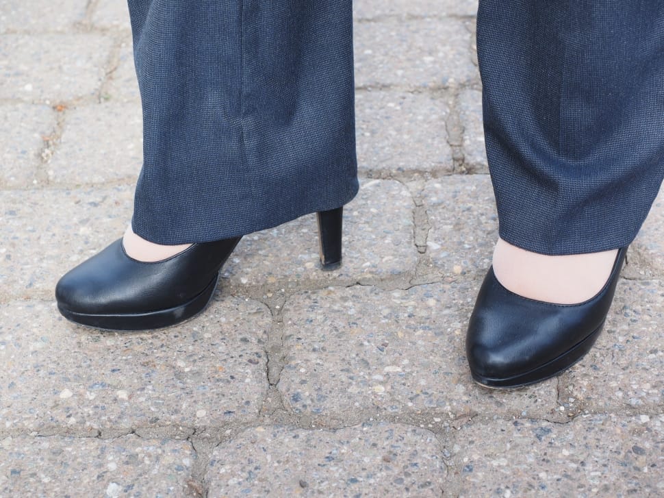 black leather platform heeled shoes and gray dress pants preview