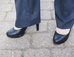 black leather platform heeled shoes and gray dress pants thumbnail