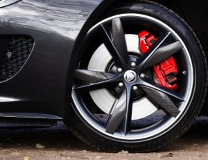 black and gray carbon fiber car wheel with tire thumbnail