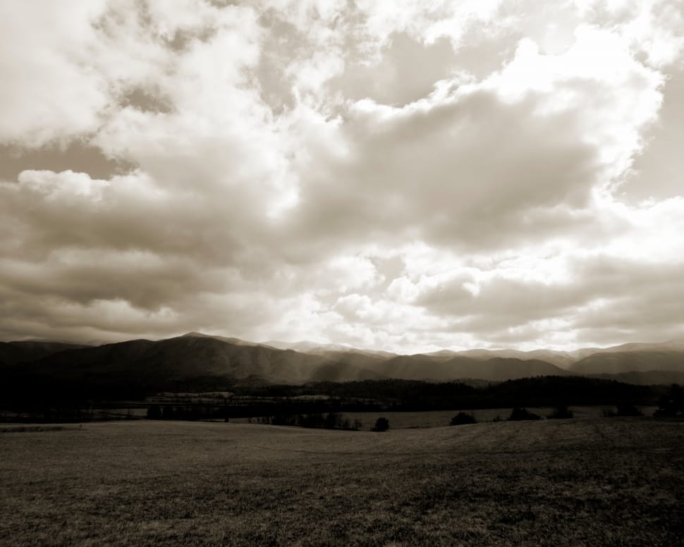 white clouds and mountain in sephia photograpy preview