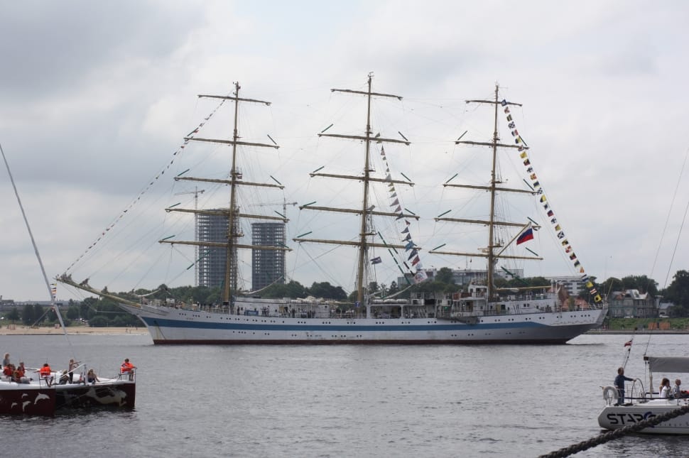 white and blue barque ship on sea preview