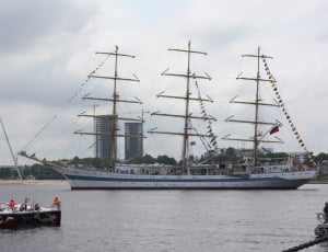 white and blue barque ship on sea thumbnail
