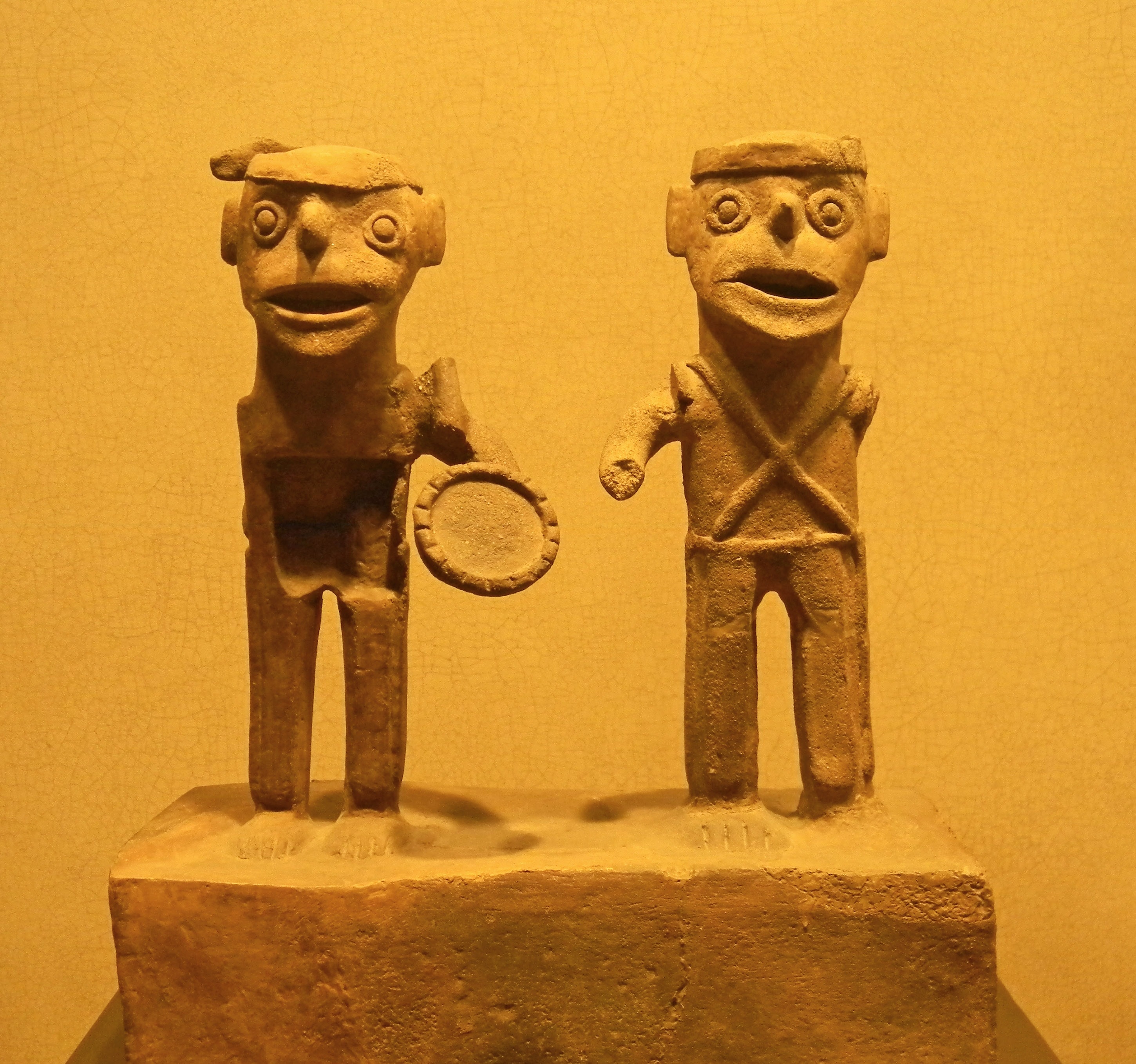 two man standing figurine