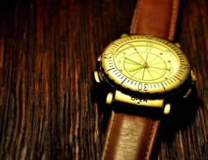 brown leather strap analog watch thumbnail