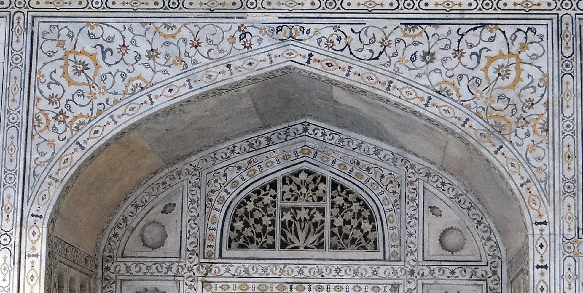 white black and beige scroll tiled arch