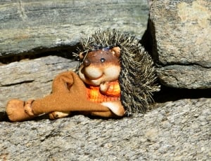 brown and black hedgehog plush toy thumbnail