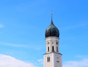 white concrete tower with green dome thumbnail