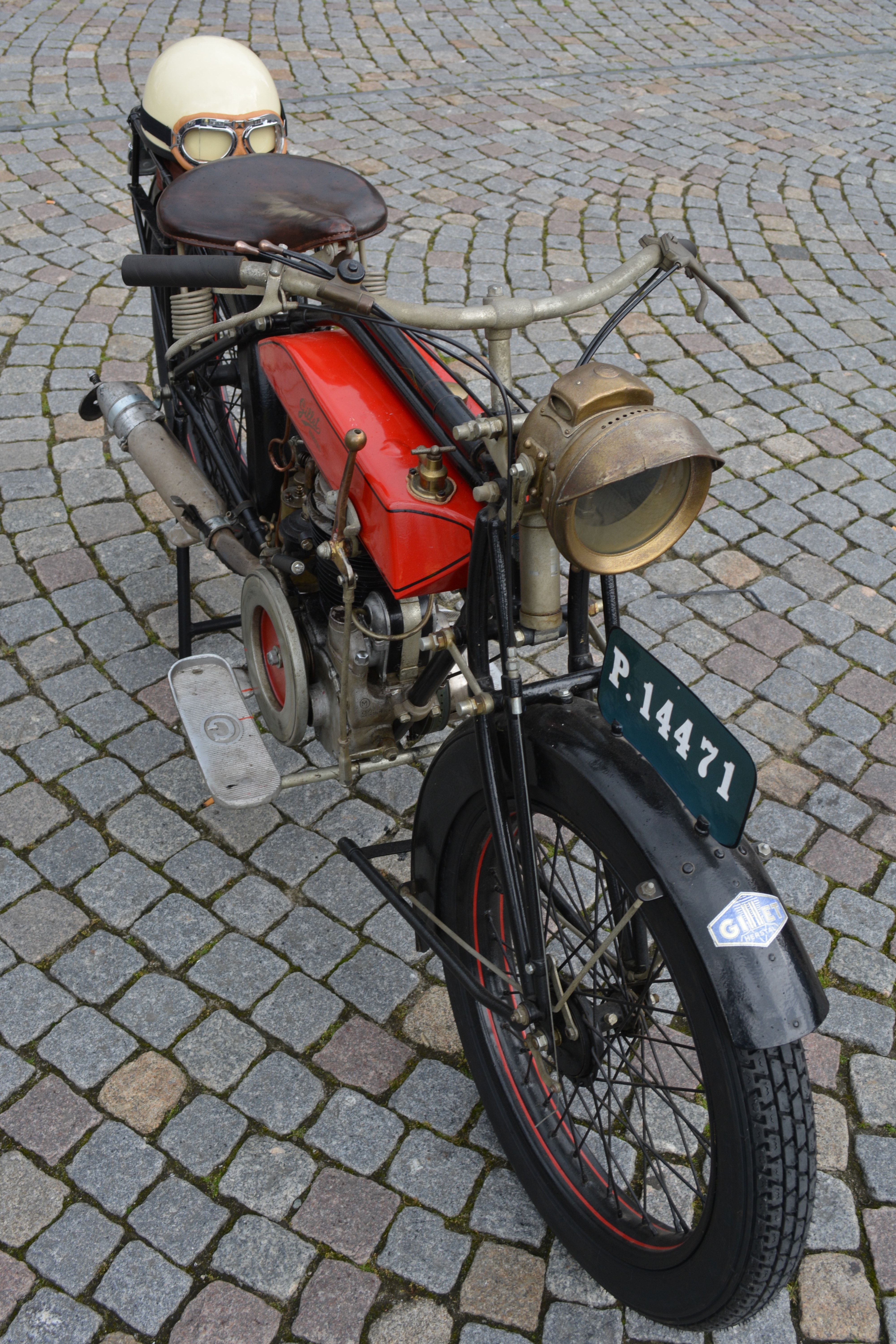 red black and brass vintage motorcycle