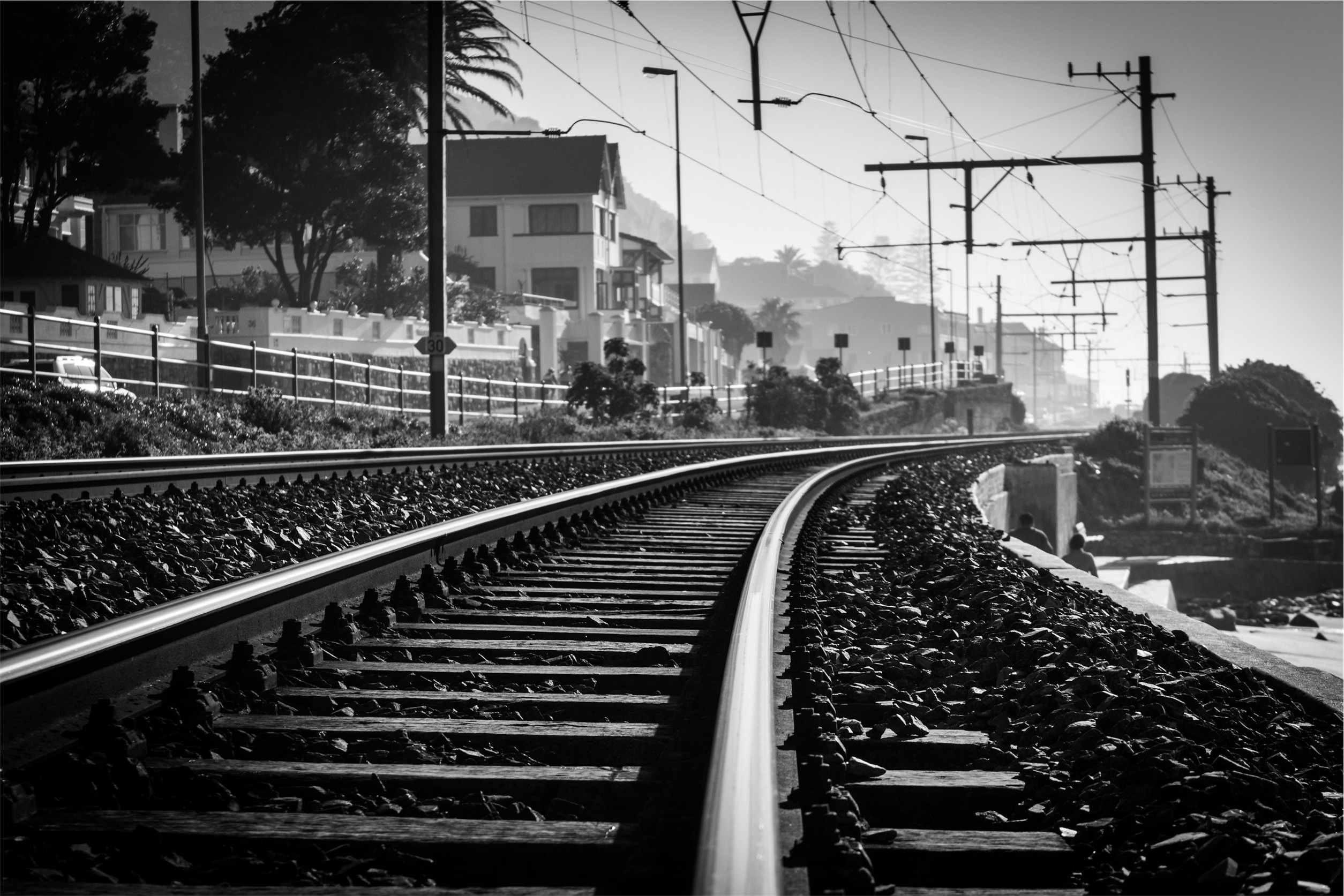 gray scale photo of train tracks