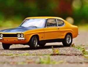 yellow and black classic car diecast scale model thumbnail