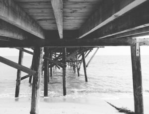 grayscale wooden bridge photo thumbnail