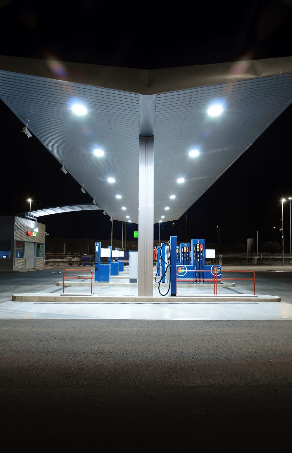 structural shot of gas station during night time preview