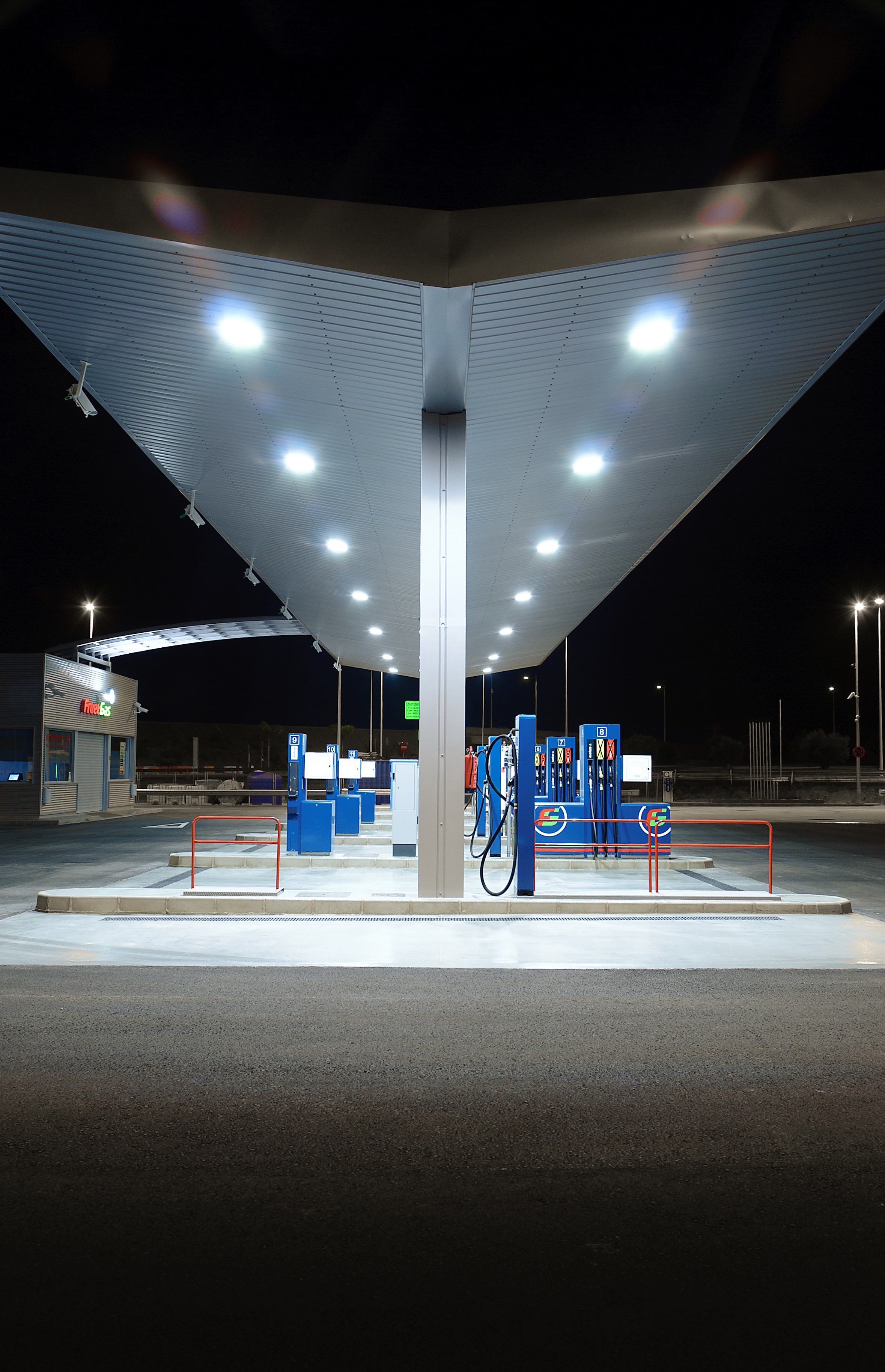 structural shot of gas station during night time