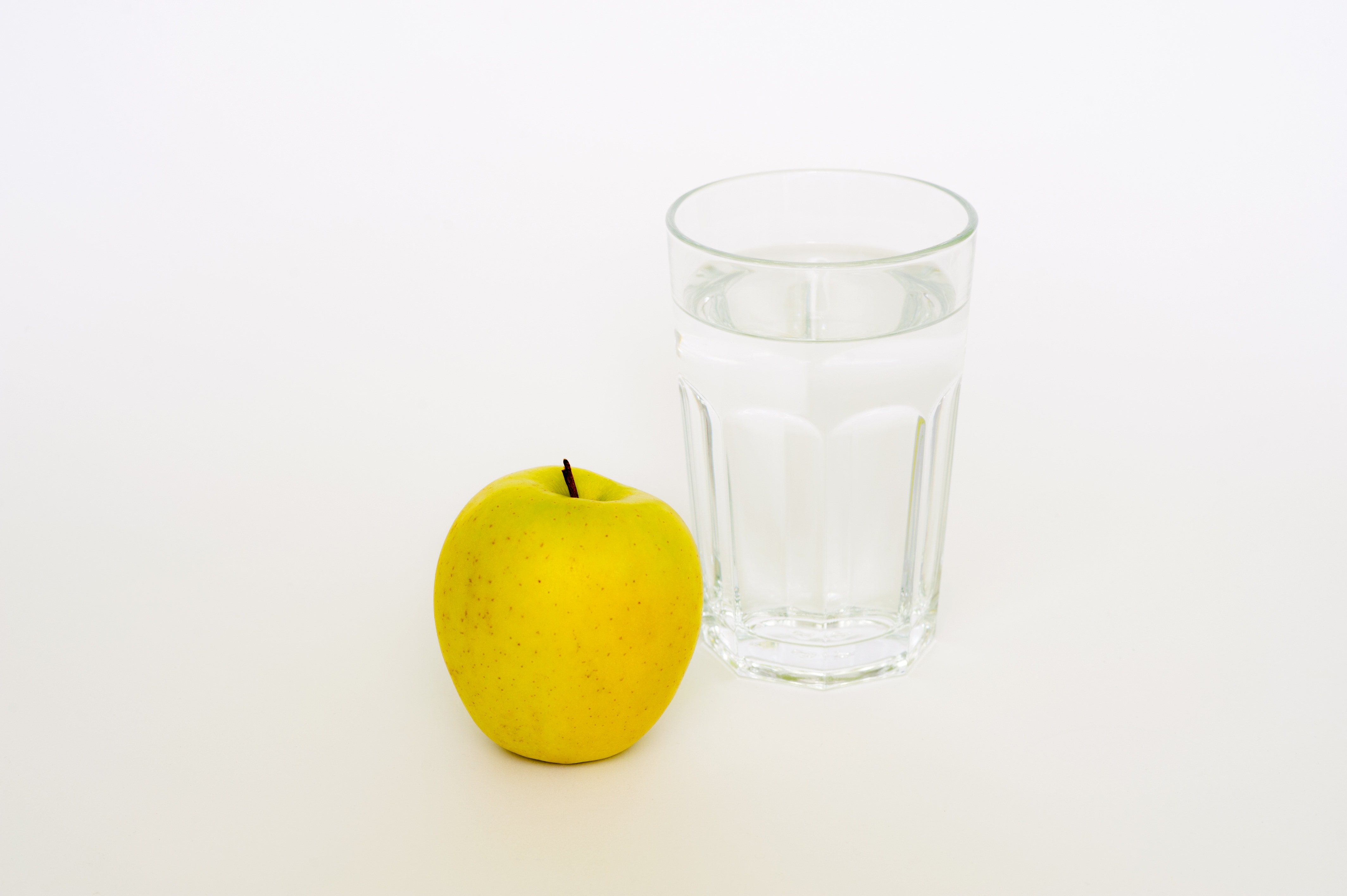 clear drinking glass yellow peach fruit