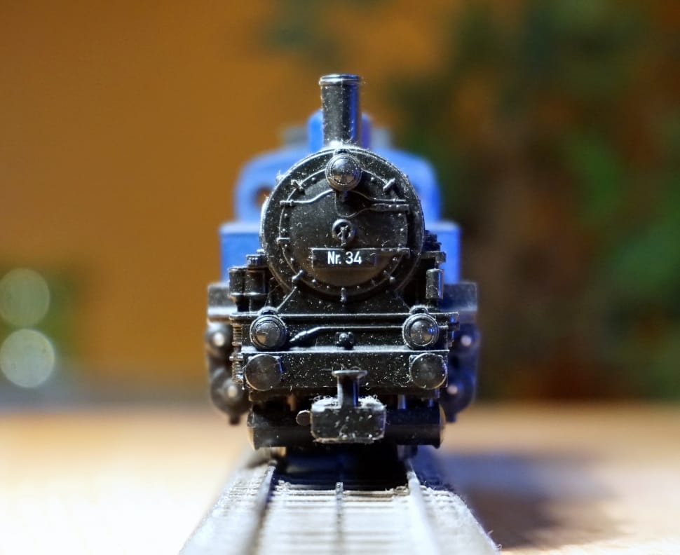 close up photo of black and light-blue train toy preview