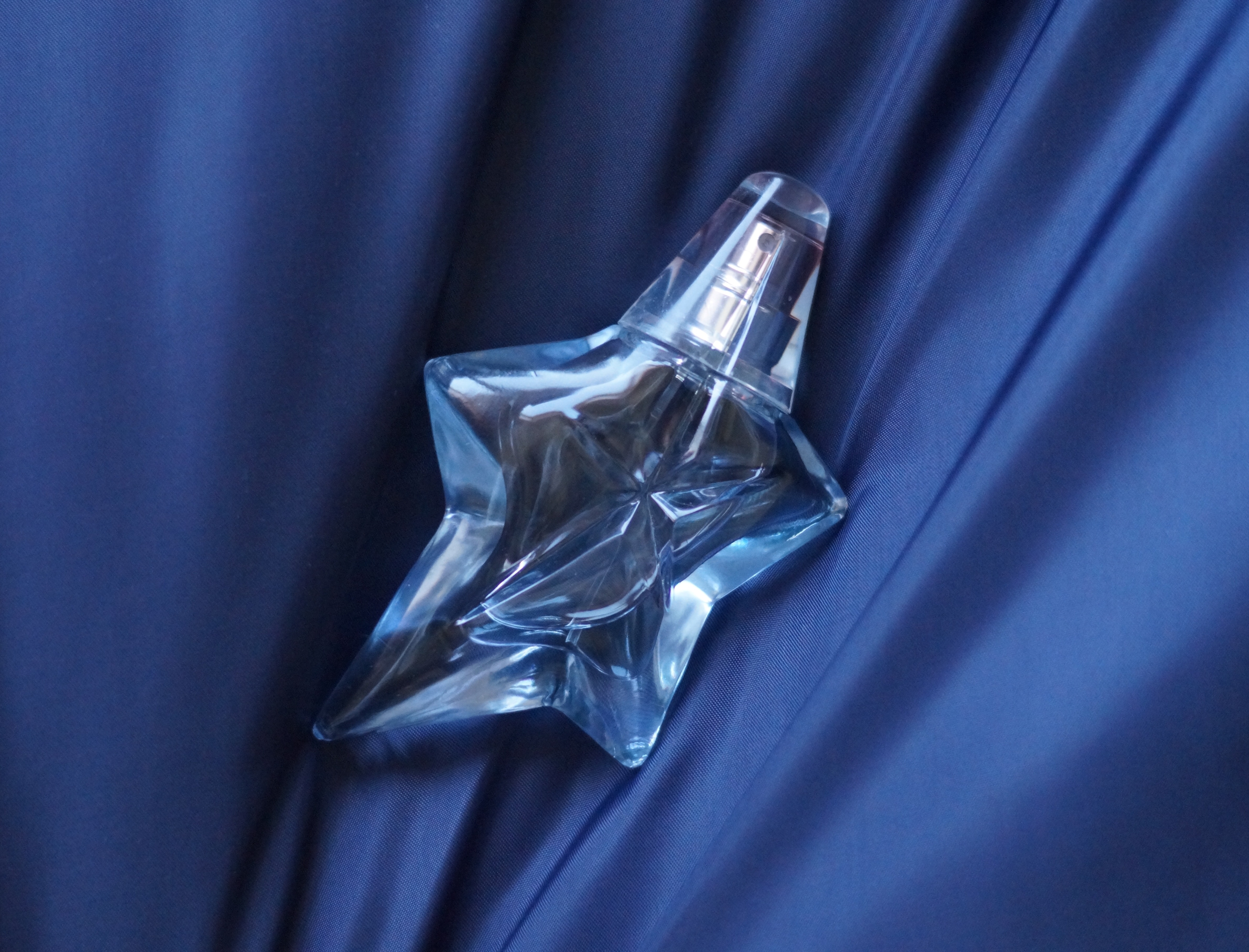 clear glass star design perfume bottle