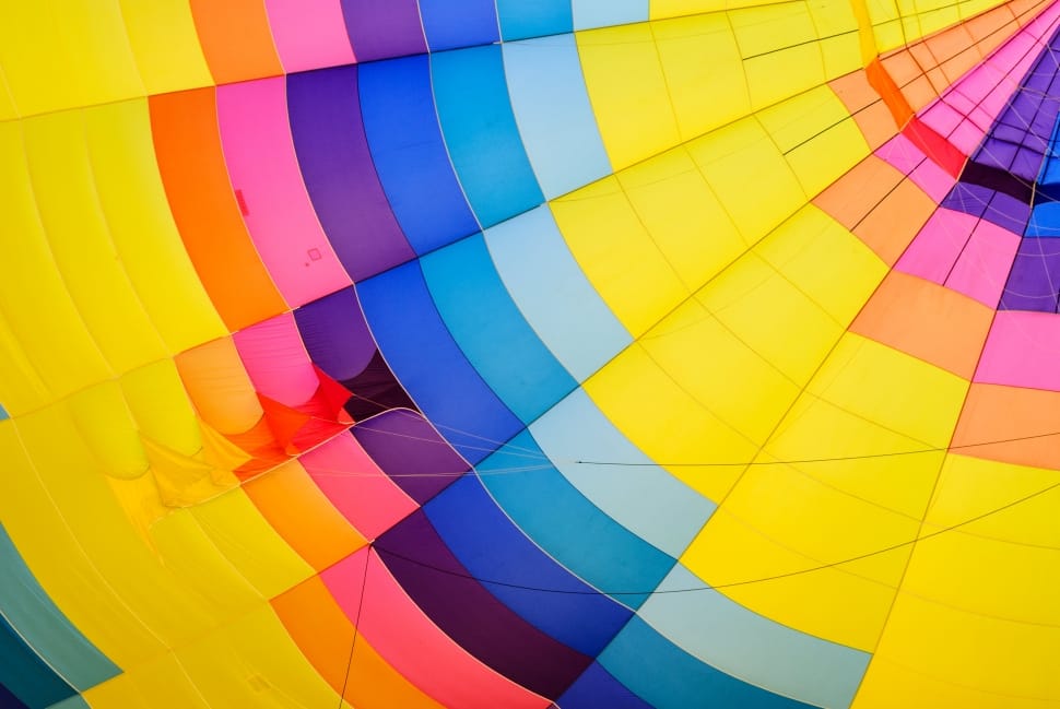 close up photo of yellow, blue and green hot air balloon preview