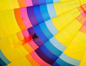 close up photo of yellow, blue and green hot air balloon thumbnail