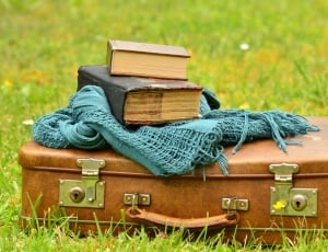 brown luggage teal scarf and books thumbnail