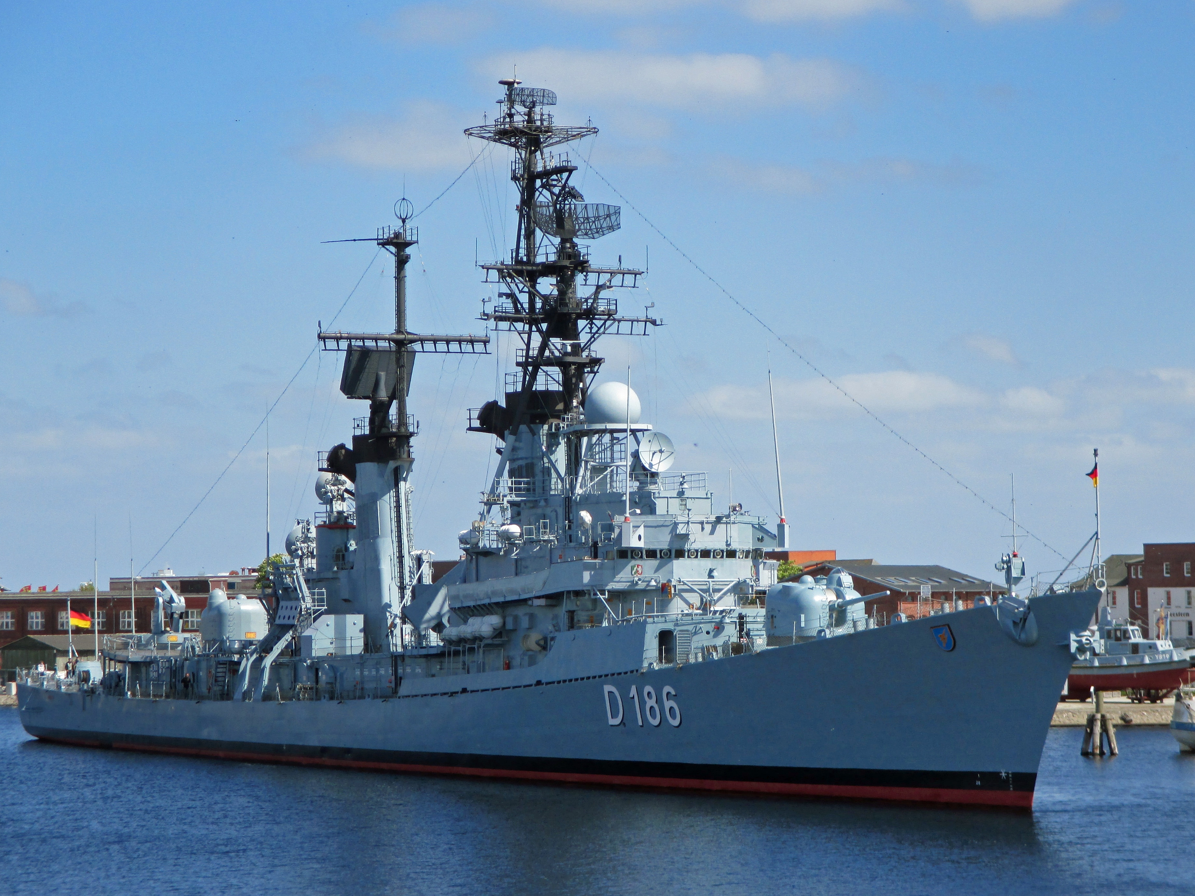 blue black and red naval ship