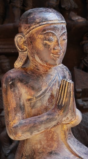 brown wooden Buddhist religious sculpture thumbnail