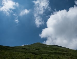 white clouds and green mountain photography thumbnail