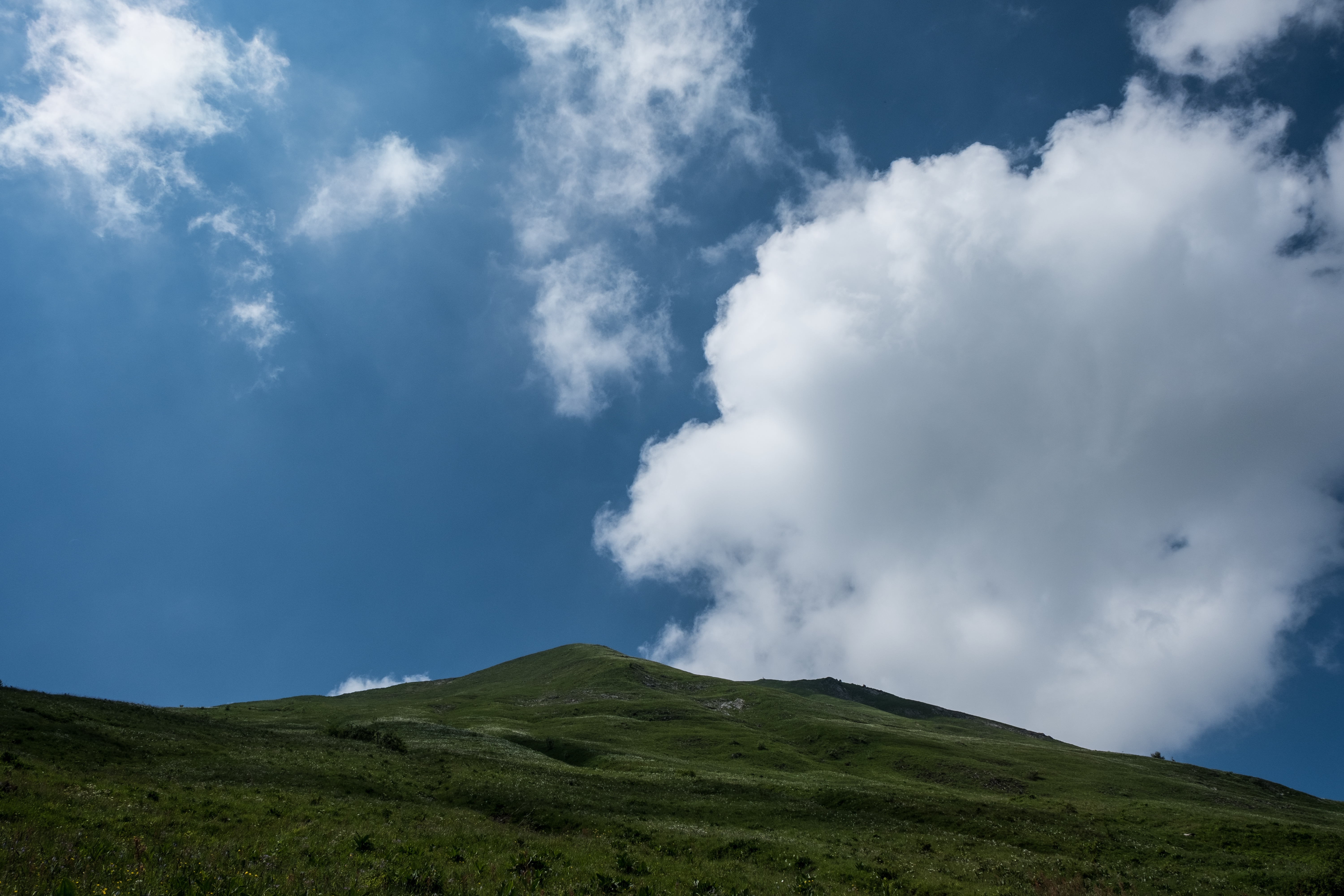 white clouds and green mountain photography