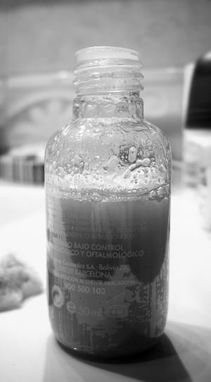 gray liquid filled clear plastic bottle thumbnail