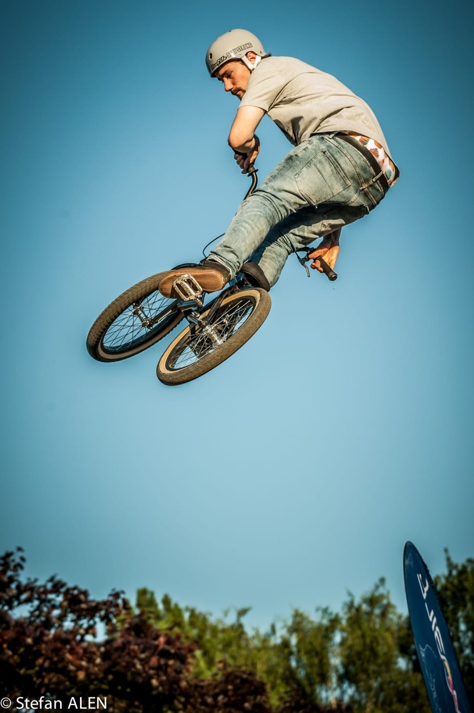 shallow focus photography of airborne BMX rider preview