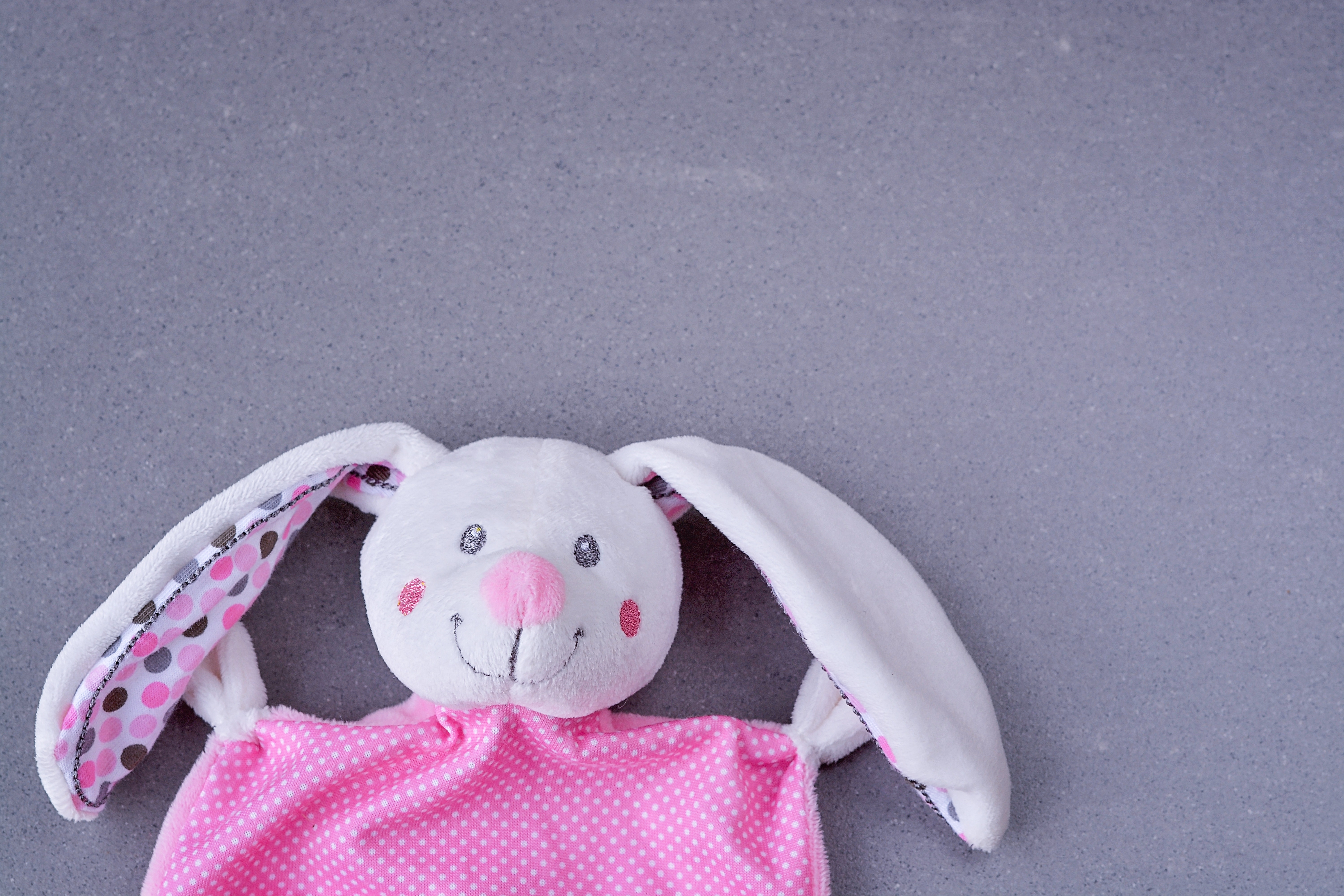 white and pink rabbit plush toy