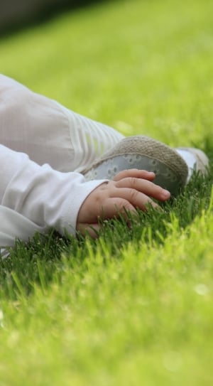 toddler on green grass field during daytime thumbnail