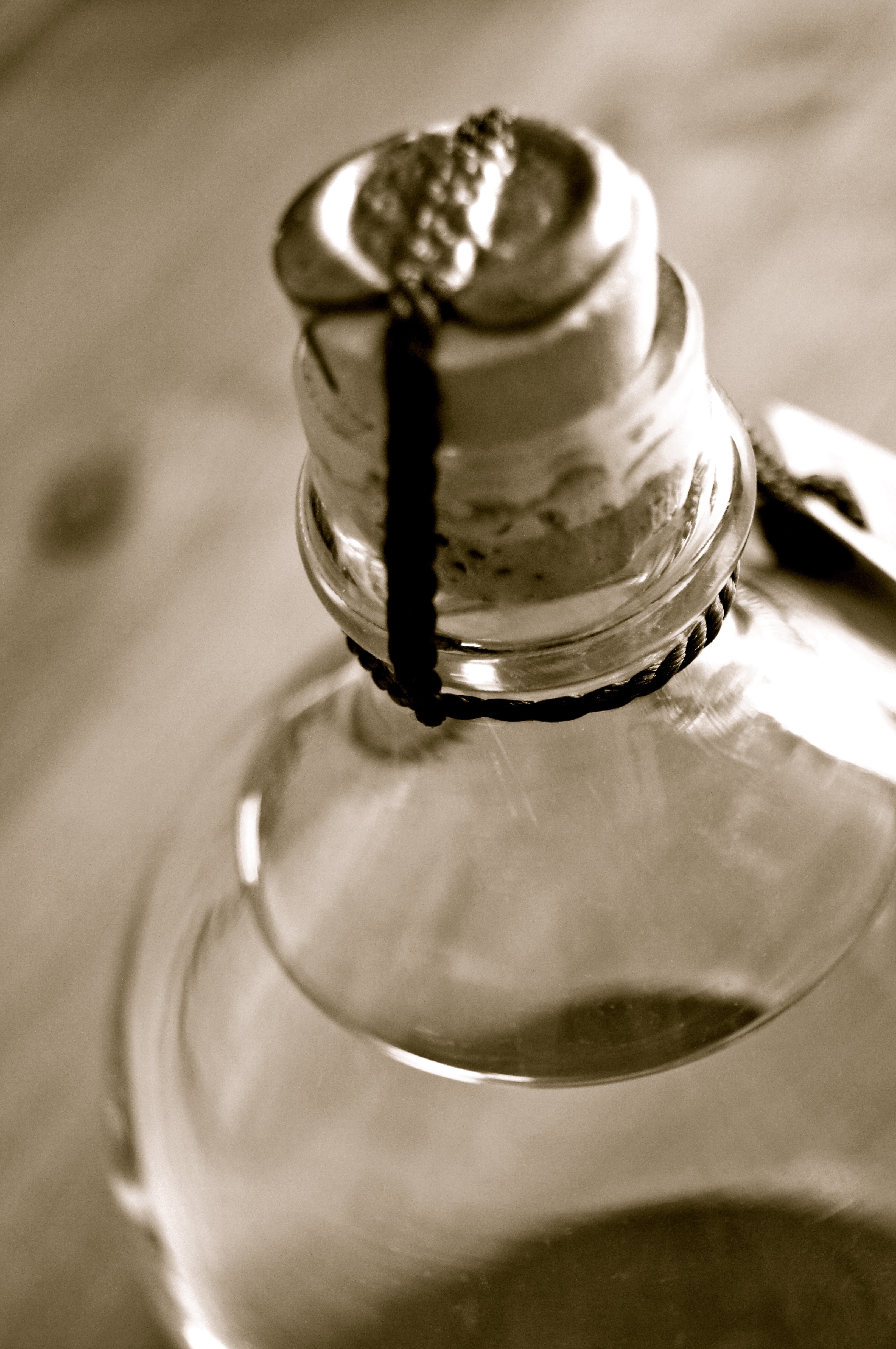 grayscale photography of unopened glass bottle