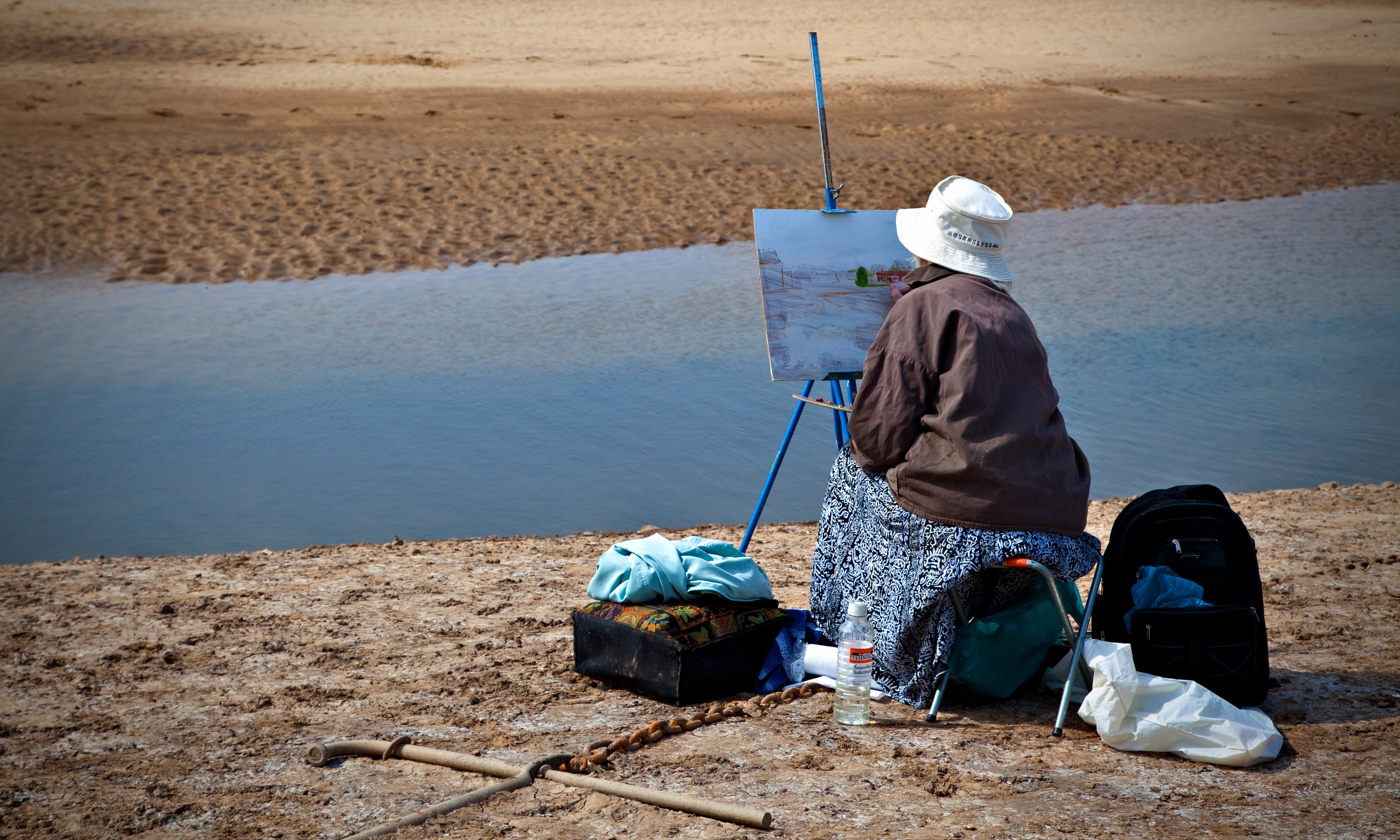woman painting an ocean