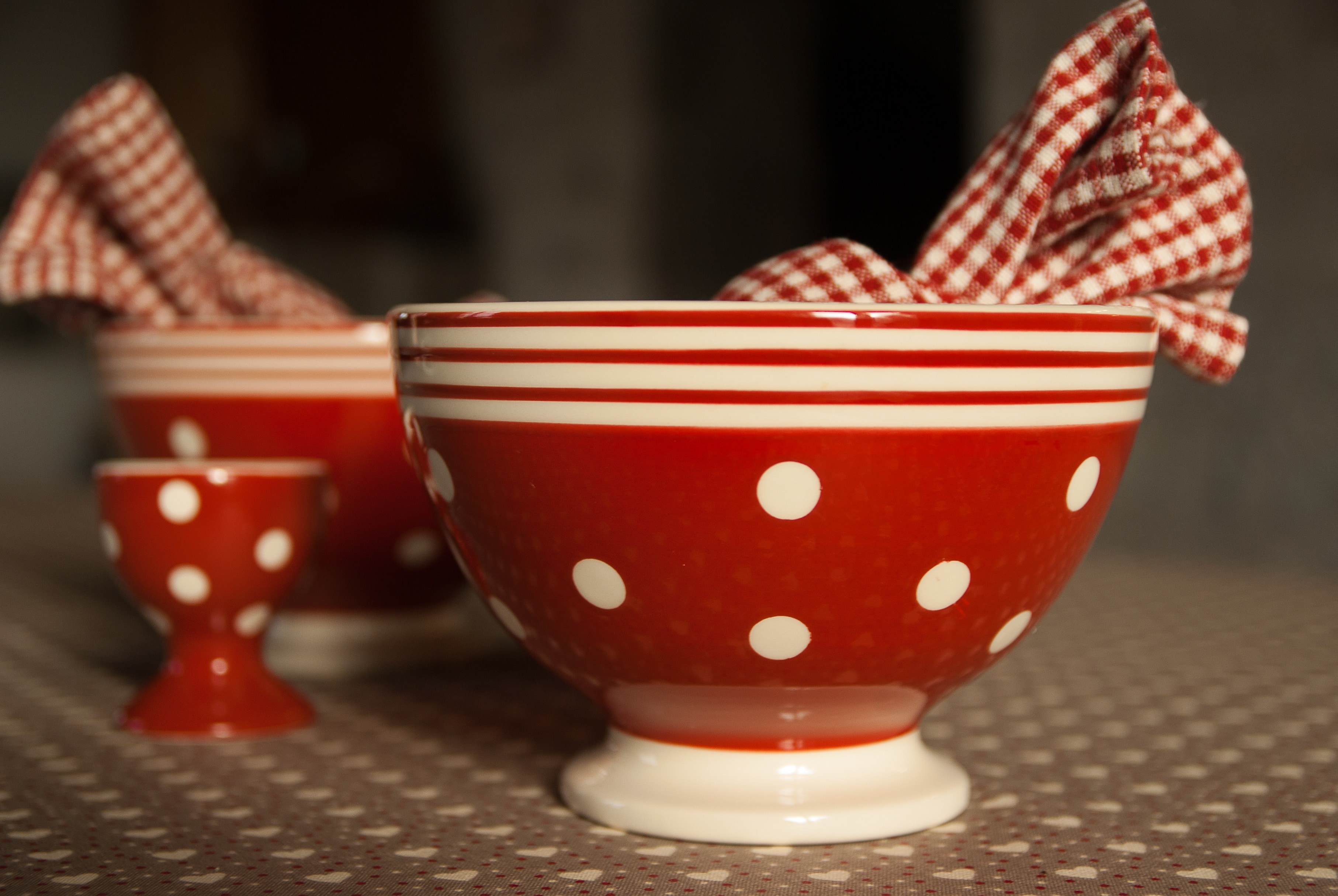 white and red ceramic bowl
