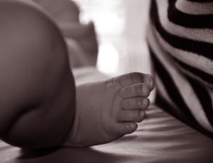 grayscale photo of baby feet thumbnail