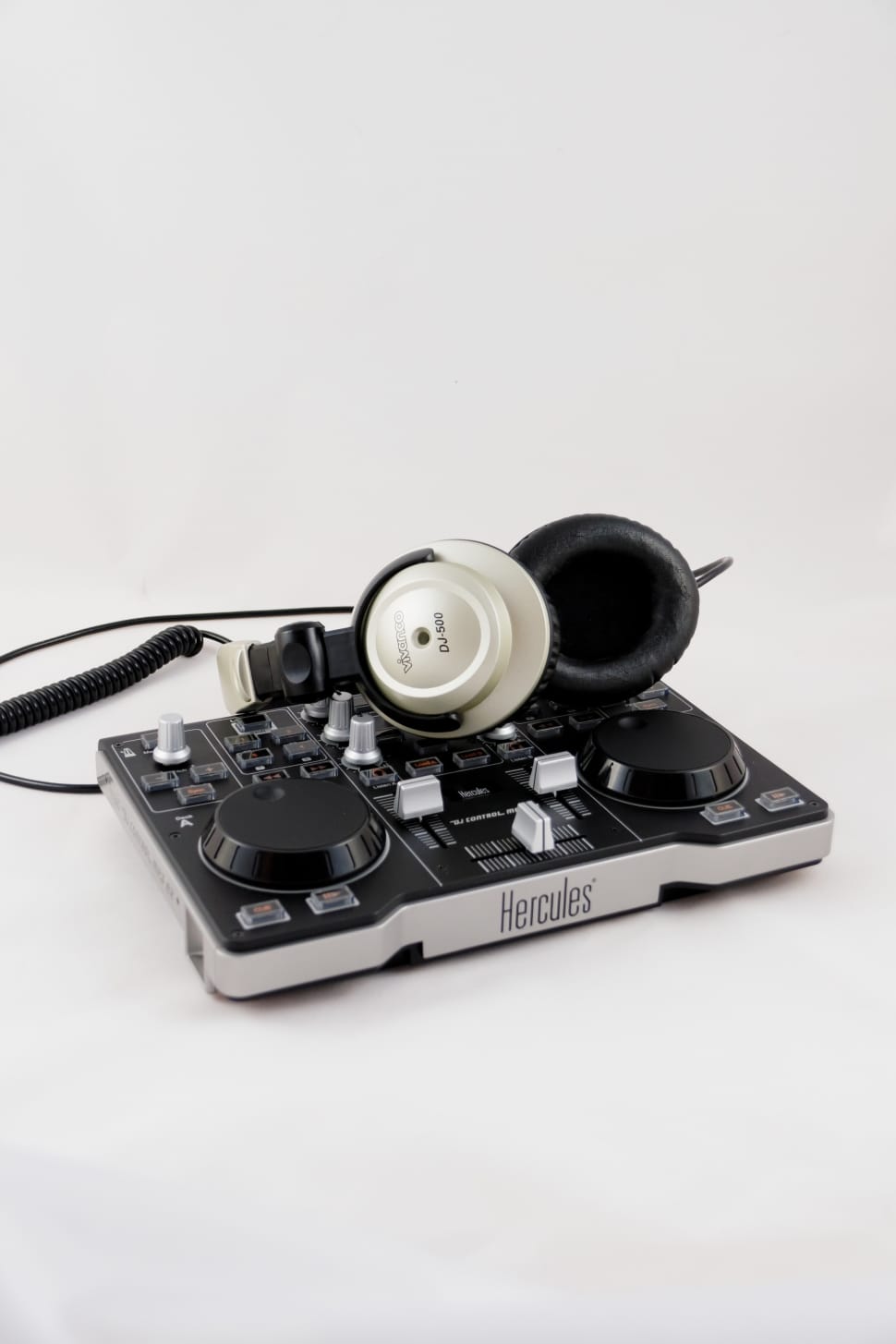 black and gray hercules dj conroller, gray headphones preview