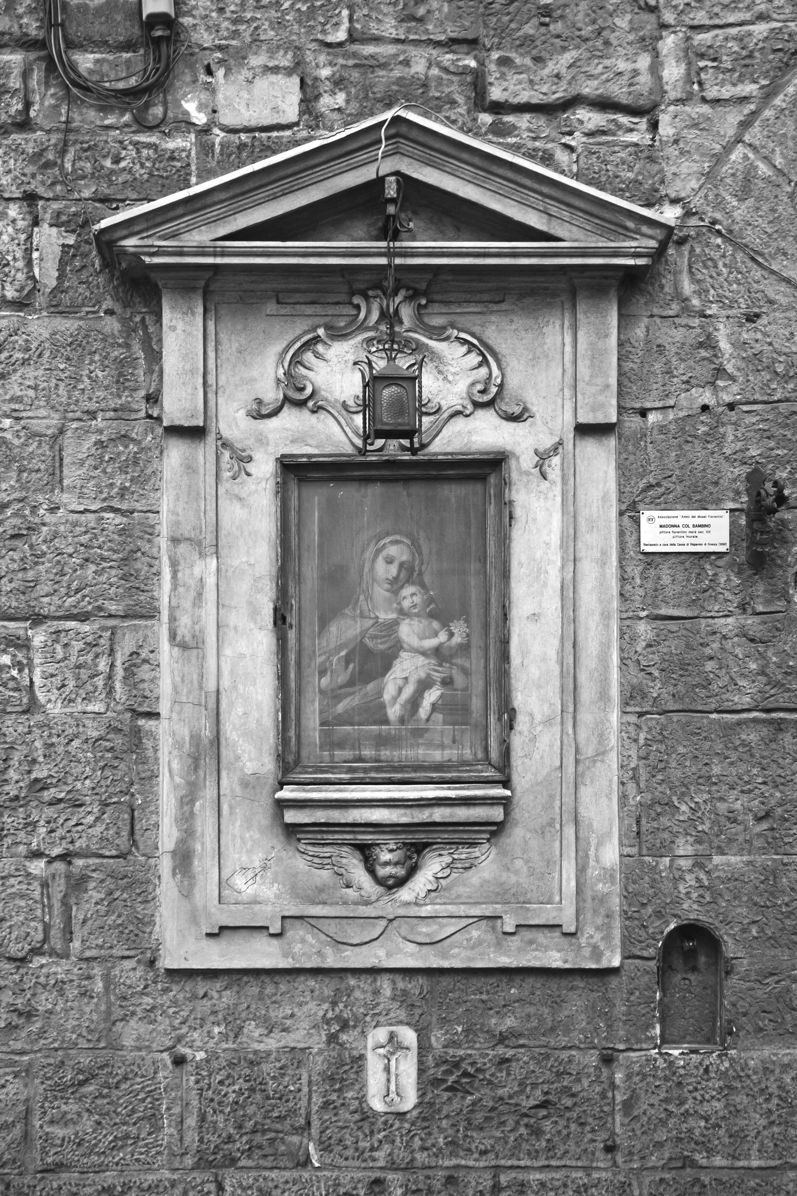 grayscale photo of religious painting on wall