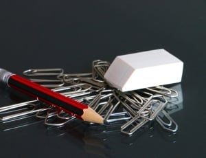 silver paper clip and red black pencil thumbnail