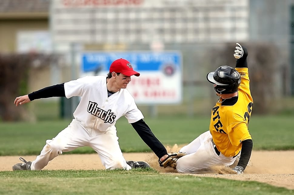 baseball catcher tagging baseball batter sliding on plate base preview