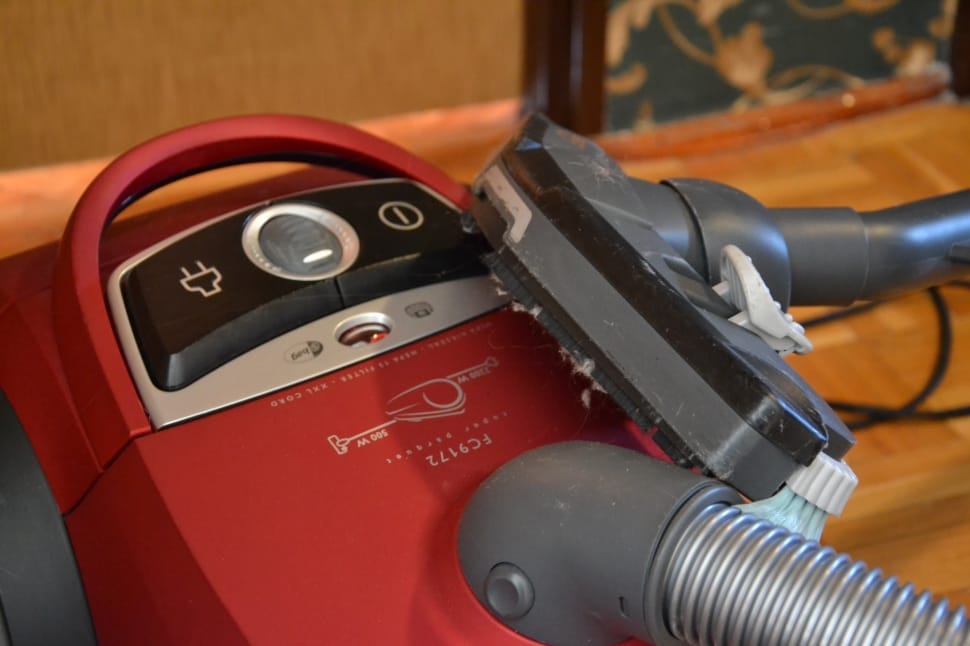 red, black and gray canister vacuum cleaner preview