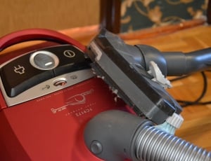 red, black and gray canister vacuum cleaner thumbnail